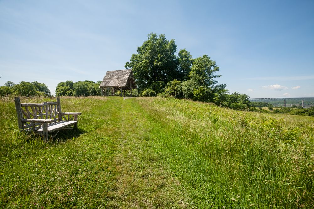 A wooden bench at Poets’ Walk Park