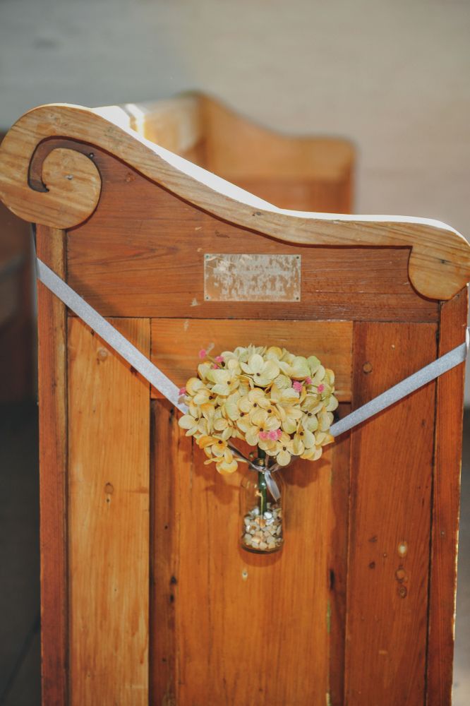 A wooden church pew in Acadian Village