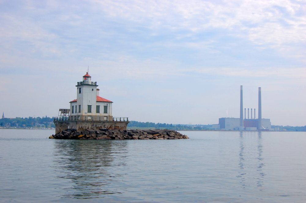 View of the Pierhead lighthouse with body of water surrounding it.