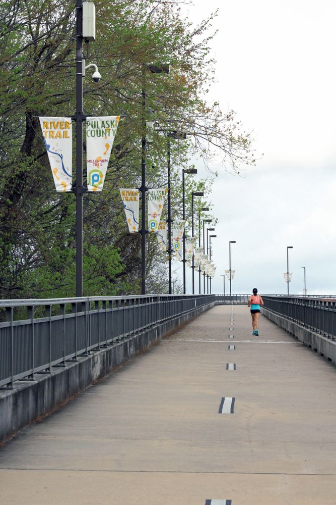 A person jogging along Big Dam Bridge