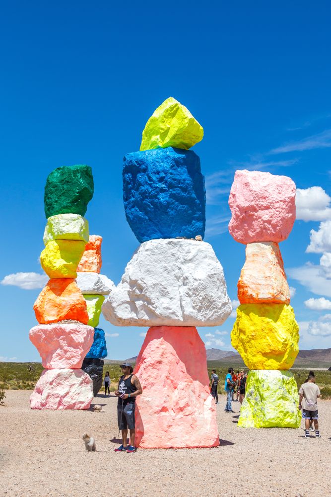 People admiring the Seven Magic Mountains