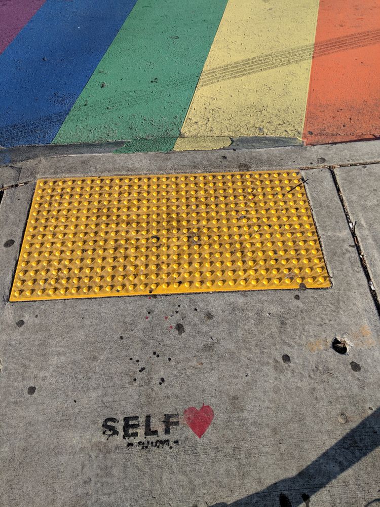 Self love quote near an Atlanta Rainbow Crosswalk