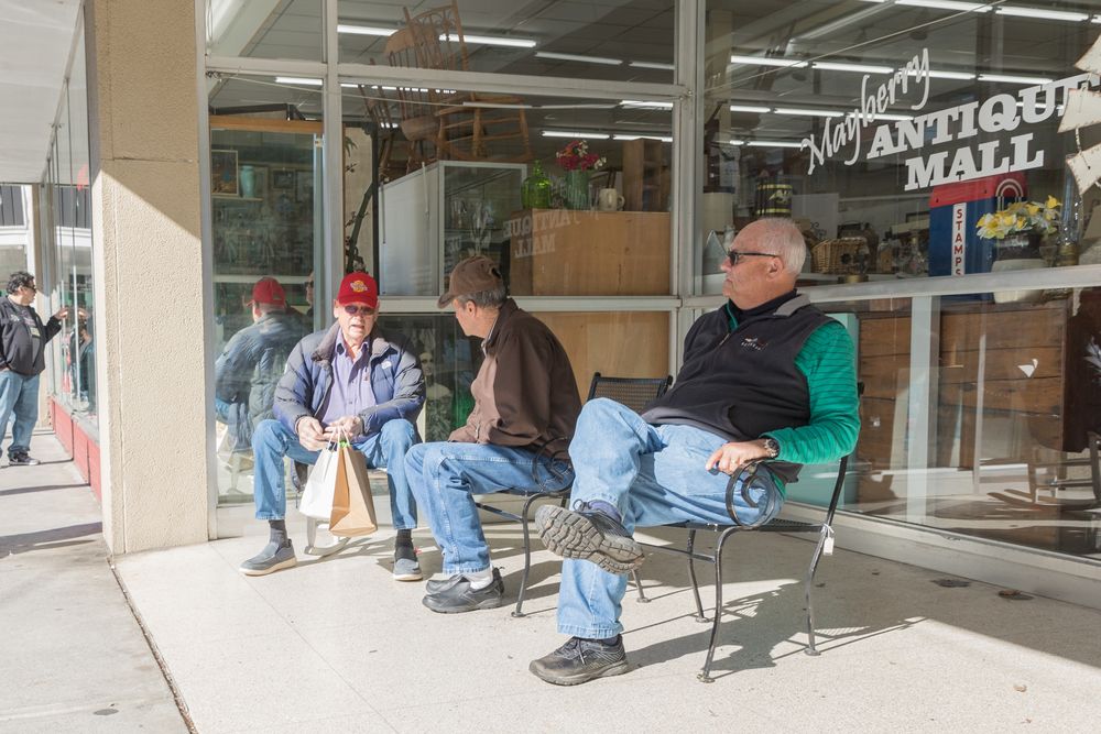 People sitting in front of Mayberry Antique Mall