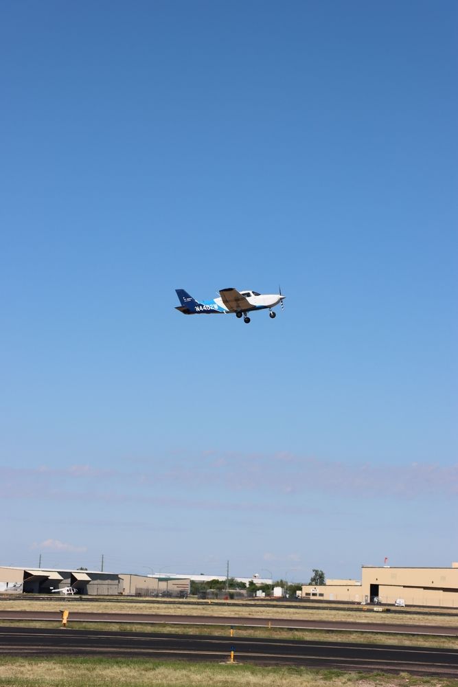 A plane over Falcon Field Airport