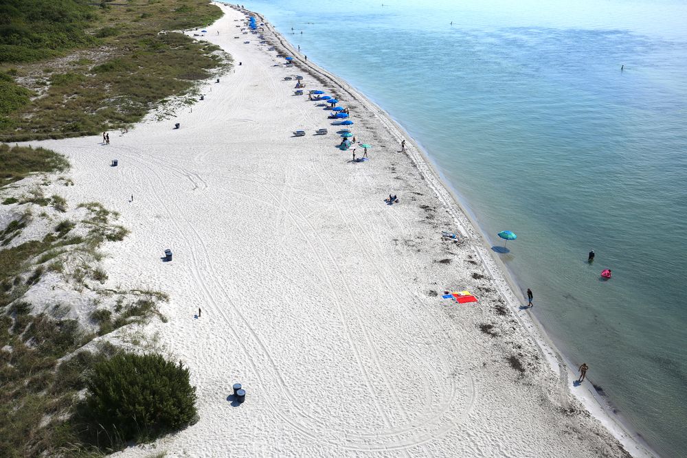 People swimming at Bill Baggs Cape Florida State Park beach