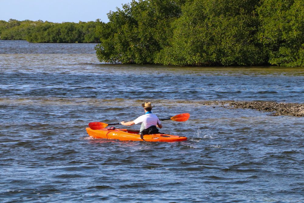 A man kayaking on Matlacha's water