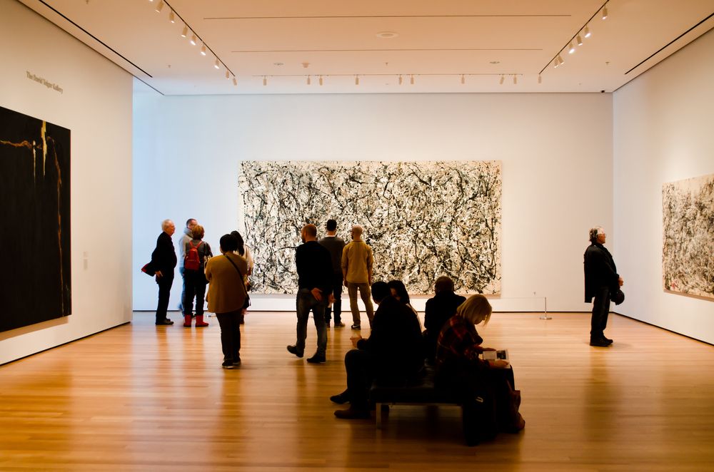 People admiring art inside Museum of Modern Art