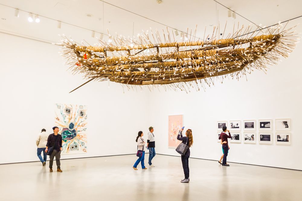 Hanging art in Museum of Modern Art