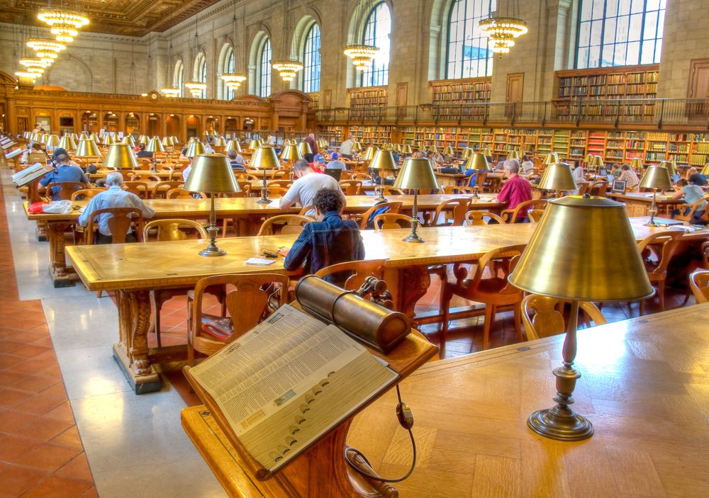 People reading inside New York Public Library