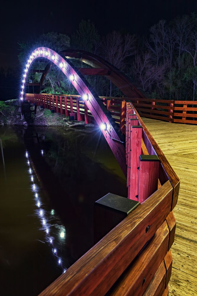The Tridge's lights reflecting on the water