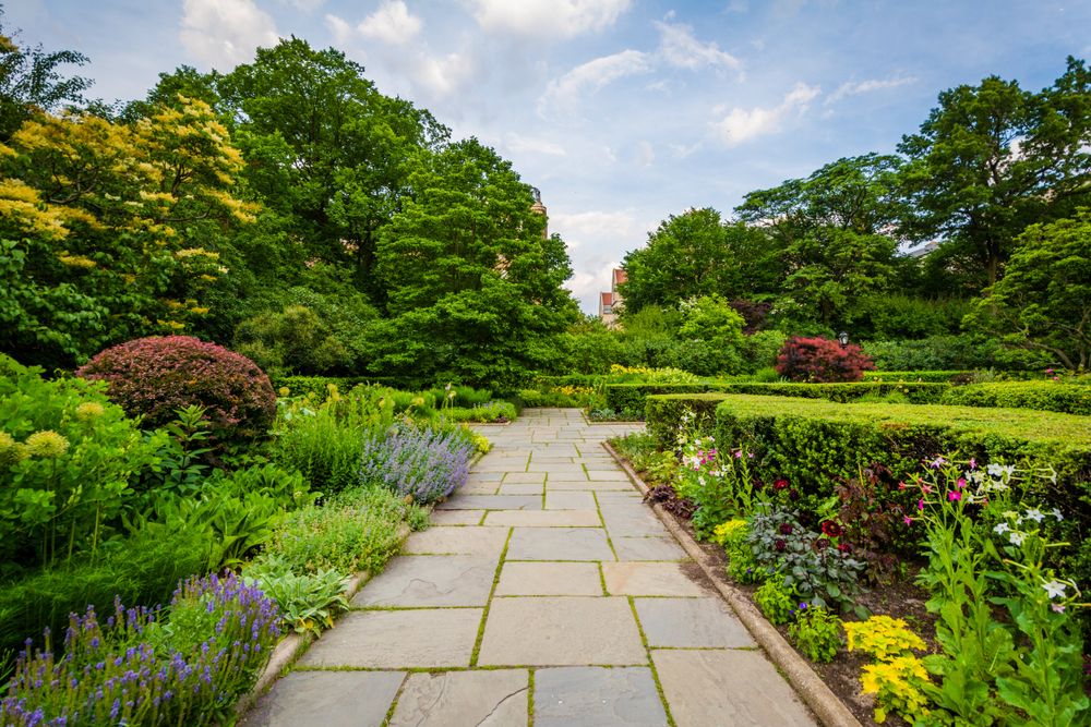 Trail lined with flora at the Conservatory Garden