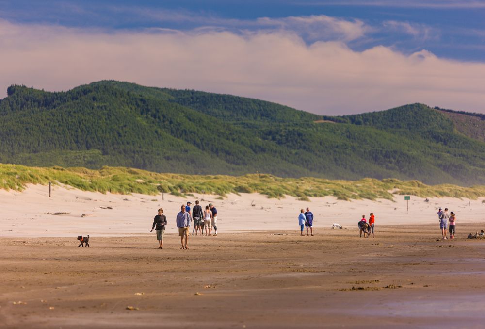 People walking along Manzanita Beach