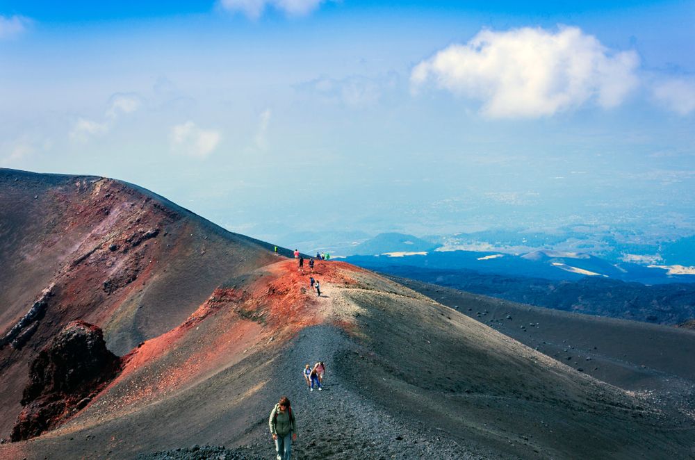 People hiking to Mount Etna Volcano