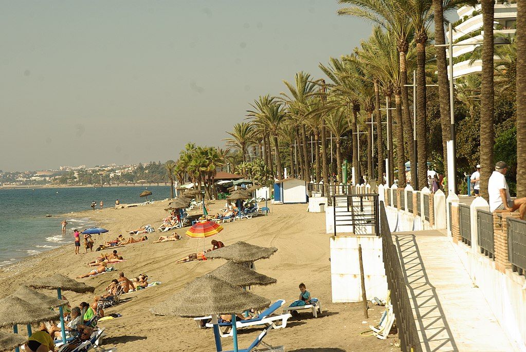 People enjoying the sun at Playa de la Fontanilla
