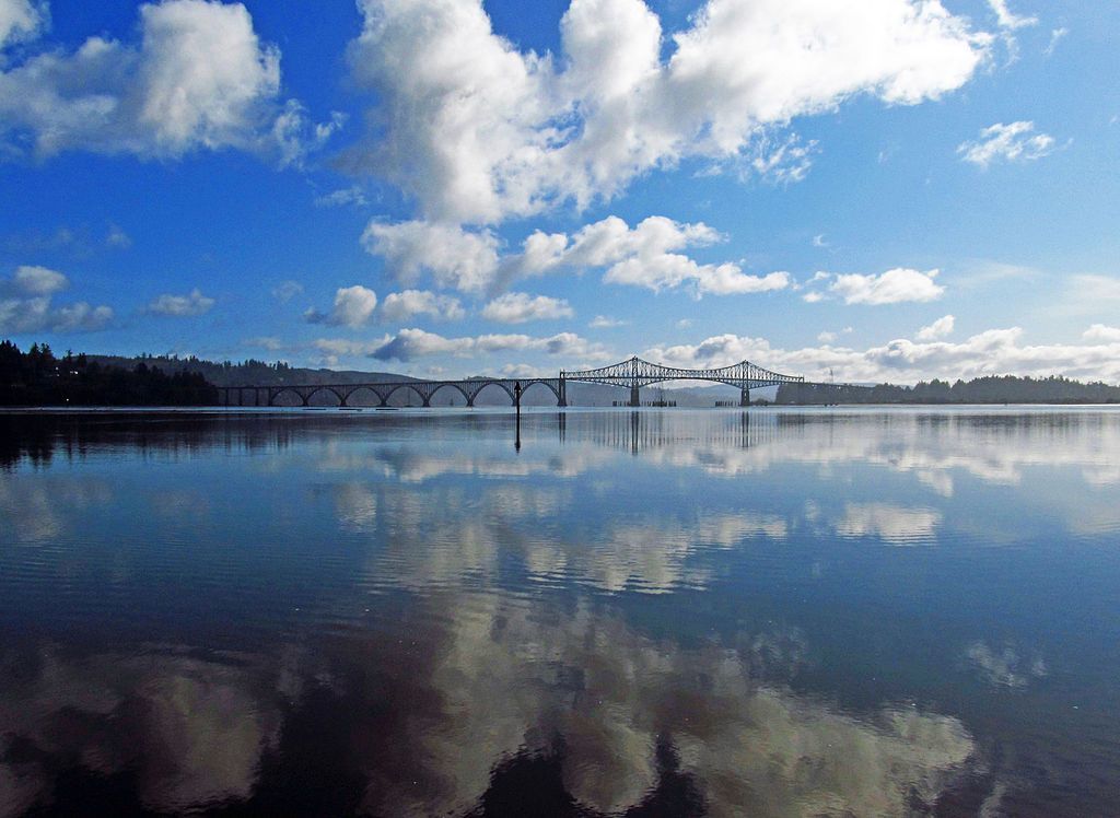 The Conde McCullough Memorial Bridge reflecting on the water