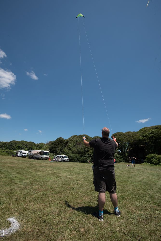 A person flying a kite at Brenton Point State Park