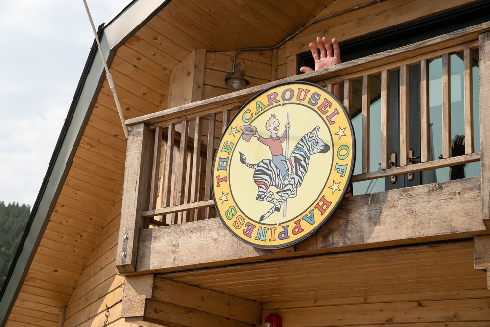 Building sign of the Carousel of Happiness