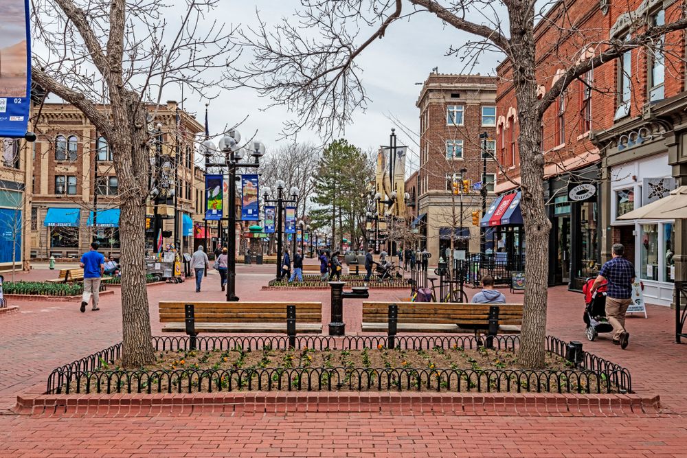 Wooden benches in the middle of Pearl Street Mall