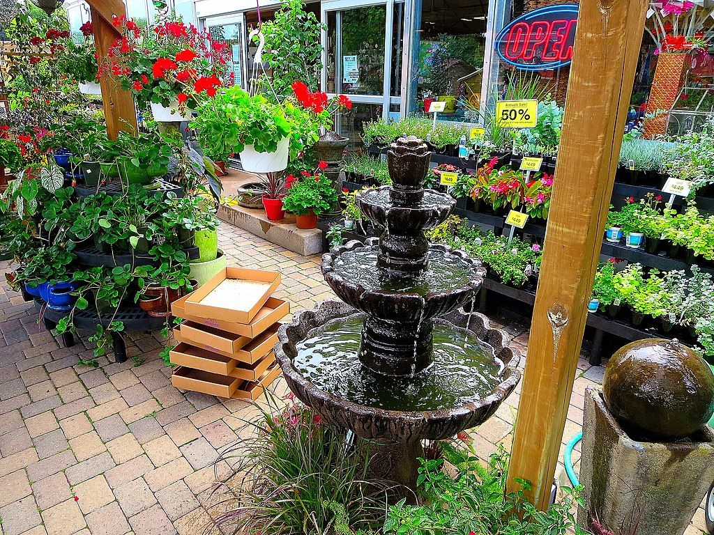 Vibrant flowers and a three tier fountain at Brenda’s Blumenladen