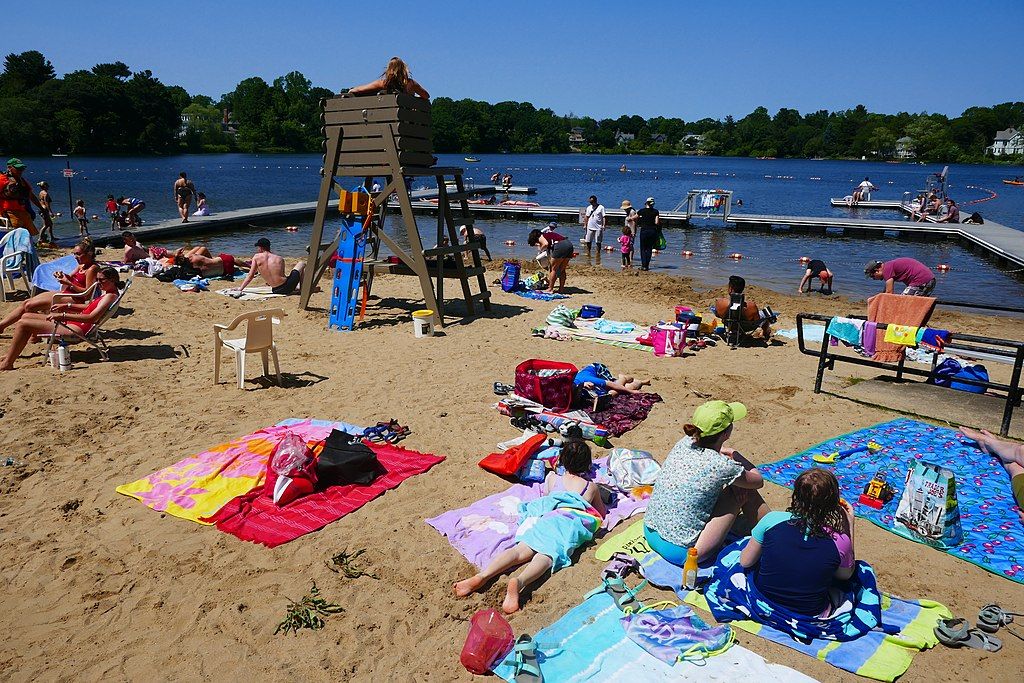 People enjoying the sun at Crystal Lake beach