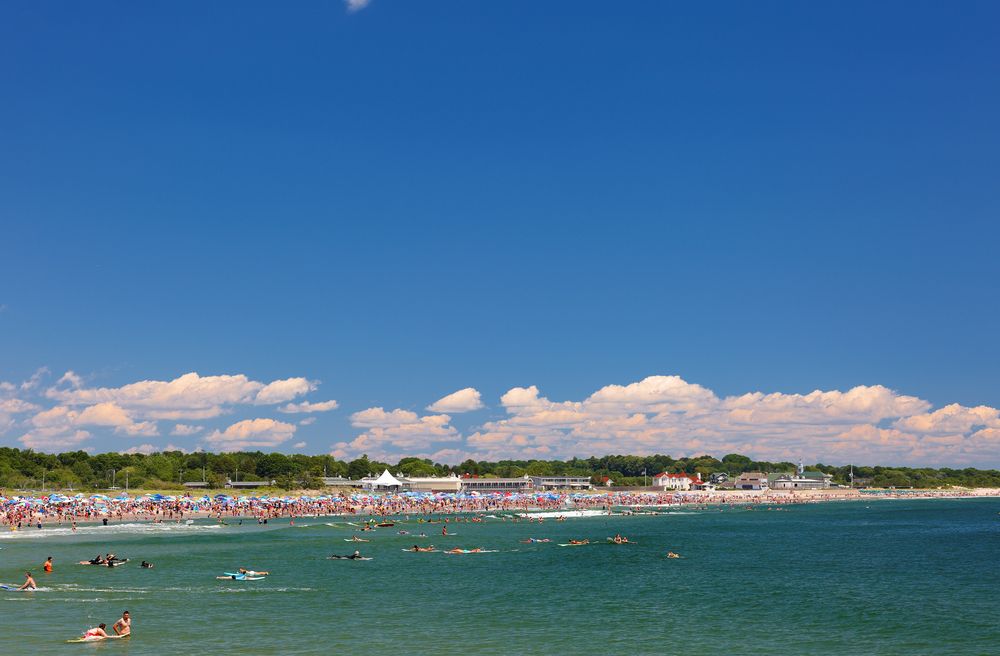 People enjoying the waters of Narragansett Town Beach