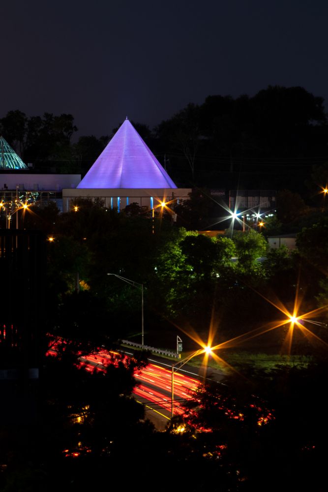 Night view of Adventure Science Center's pyramid