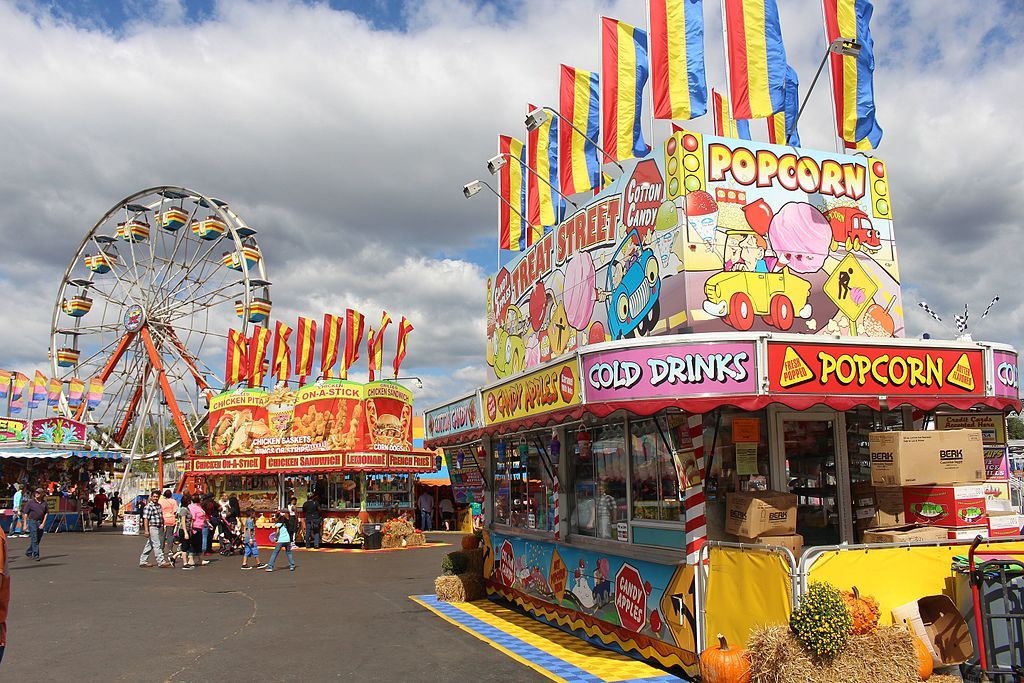 Popcorn stall near a ferris wheel at Georgia National Fair