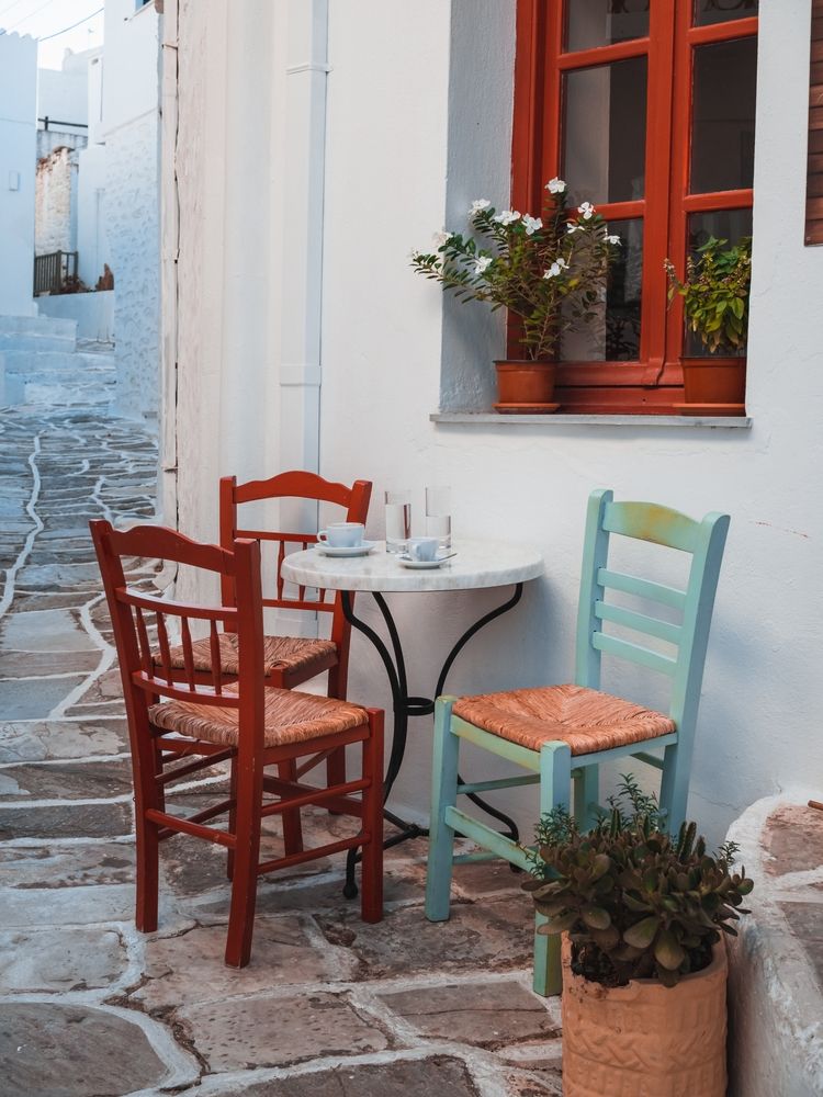 Cute coffee table with three chairs along Lefkes street