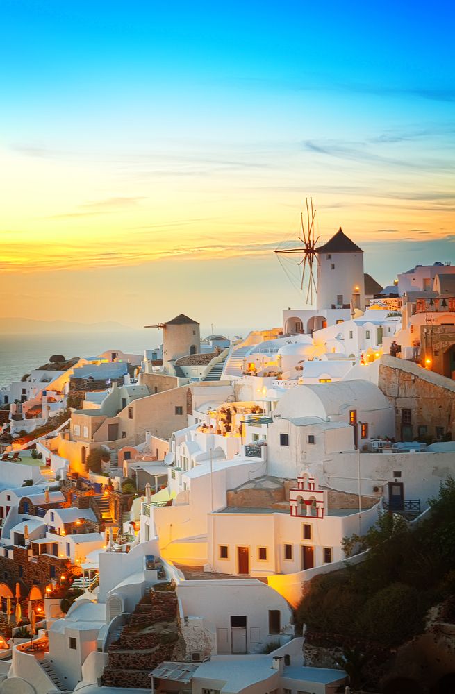 Scenic sunset view of a village in Santorini