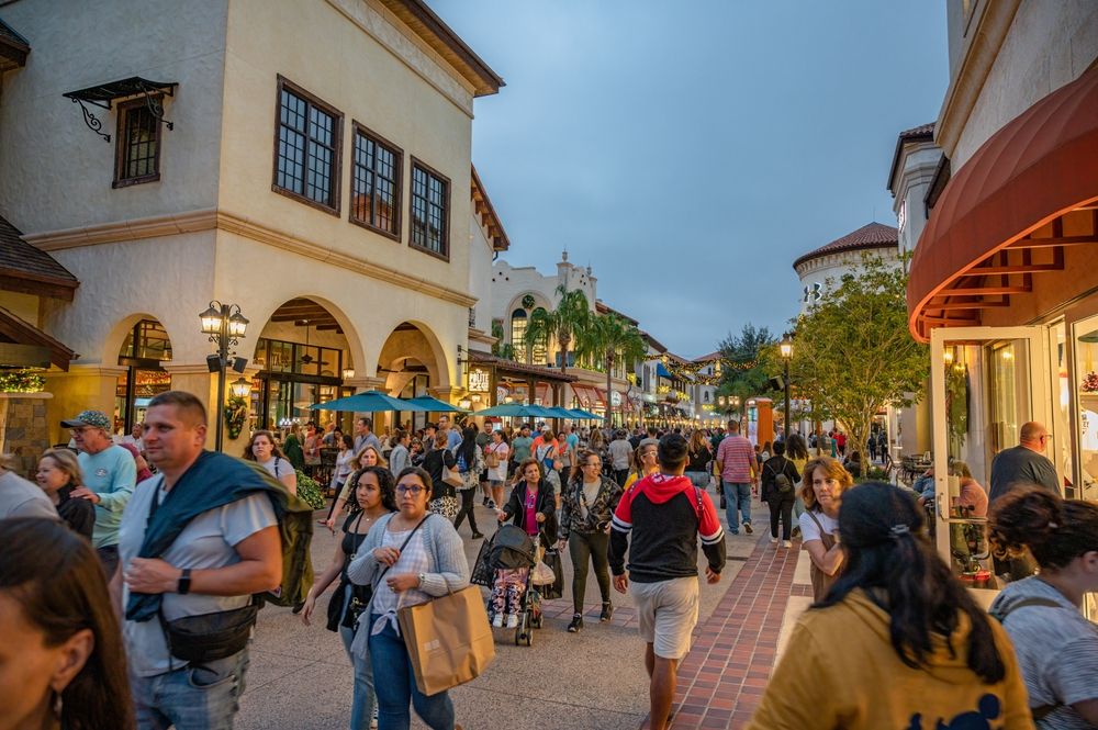 People walking along Disney Springs