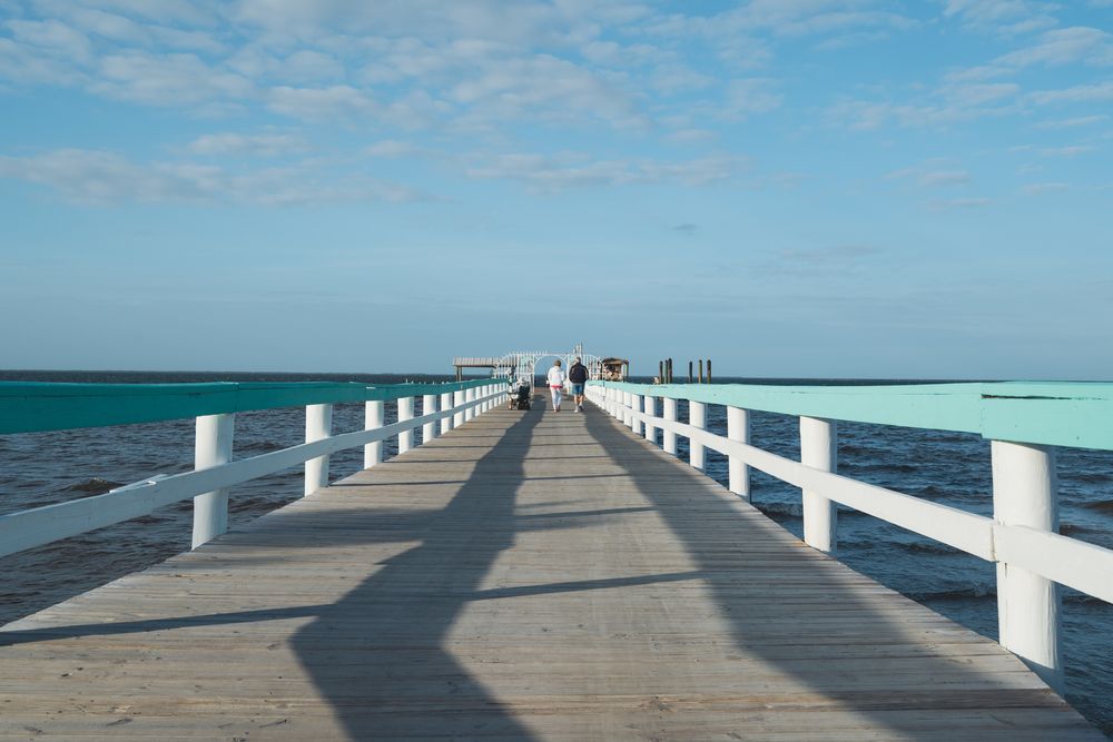 People walking along Bokeelia Fishing Pier