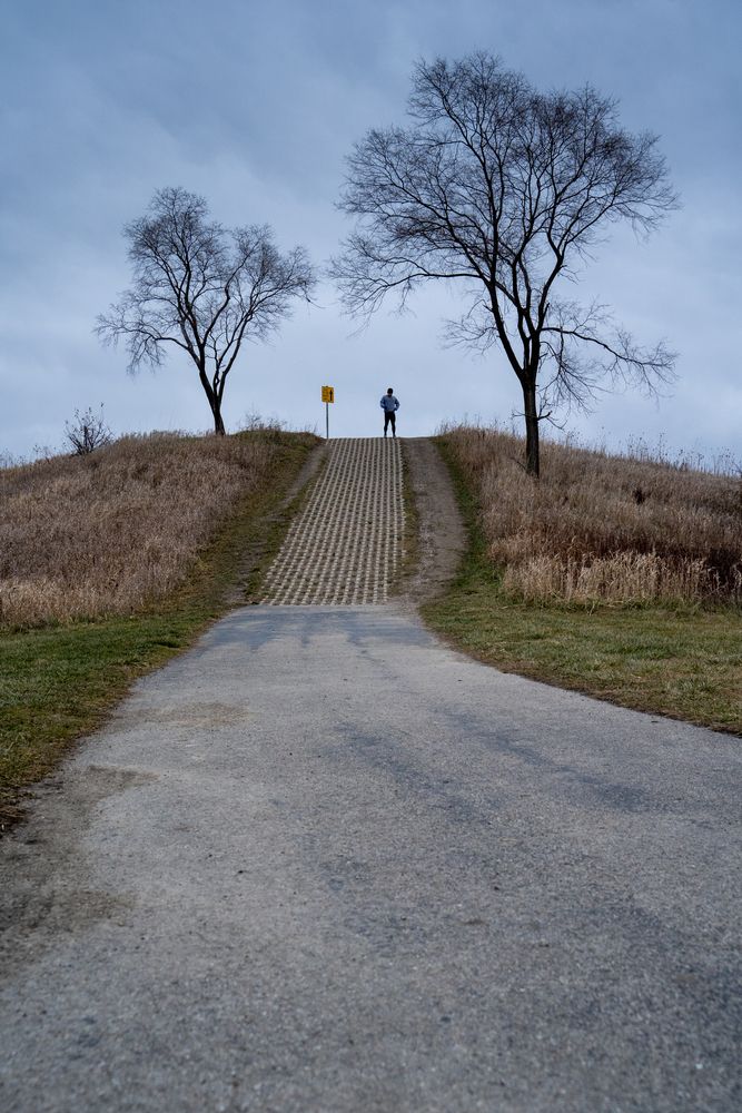 A man walking along Margreth Riemer Reservoir Park