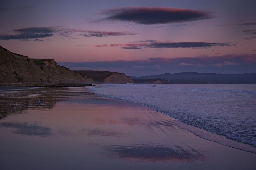 Dusk skies reflecting on Drakes Beach waters.