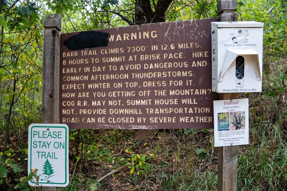 Warning sign of Barr Trail about weather conditions