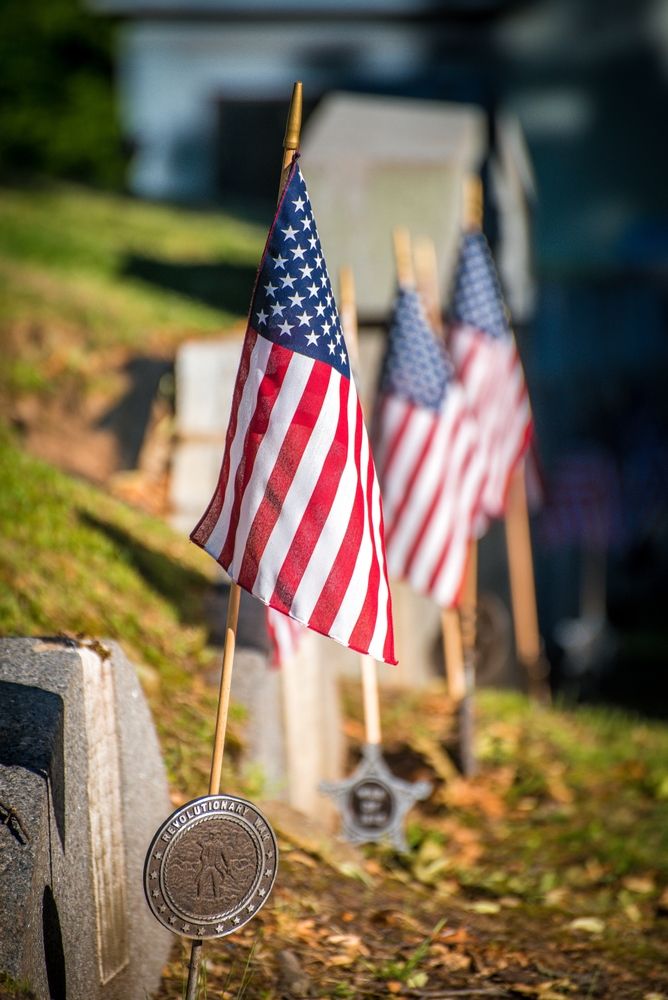Small U.S flags at the Historic Hancock Cemetery