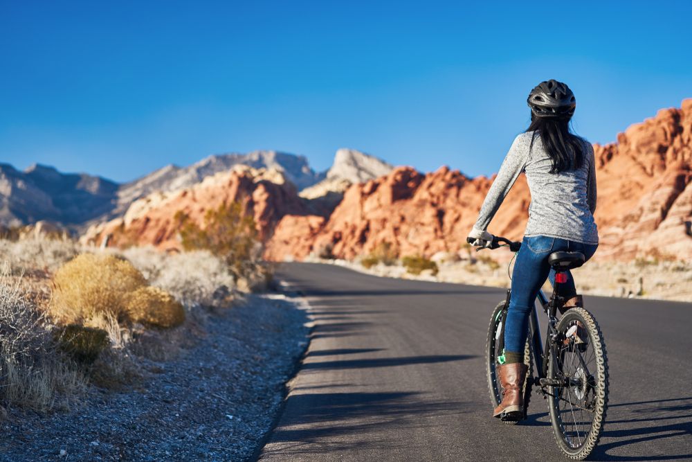 A person riding his bike along Red Rock Canyon