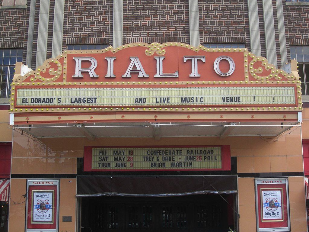 Rialto Theatre sign board with play schedules.
