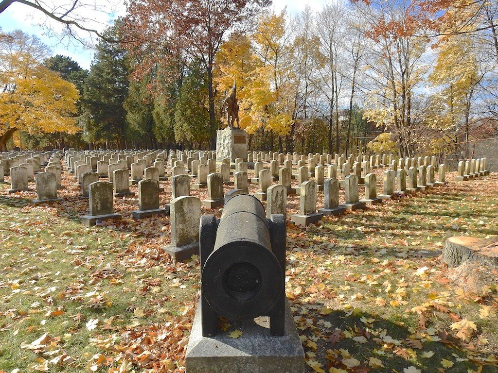 Defenders of the flag headstones and sculpture at Mount Hope Cemetery