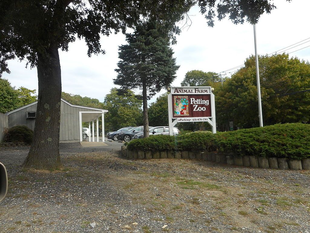 Signage of Animal Farm Petting Zoo
