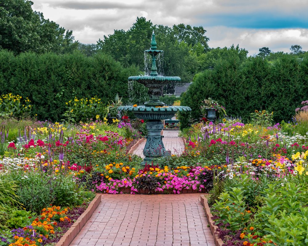 Water fountain surrounded with flowers at Munsinger and Clemens Gardens