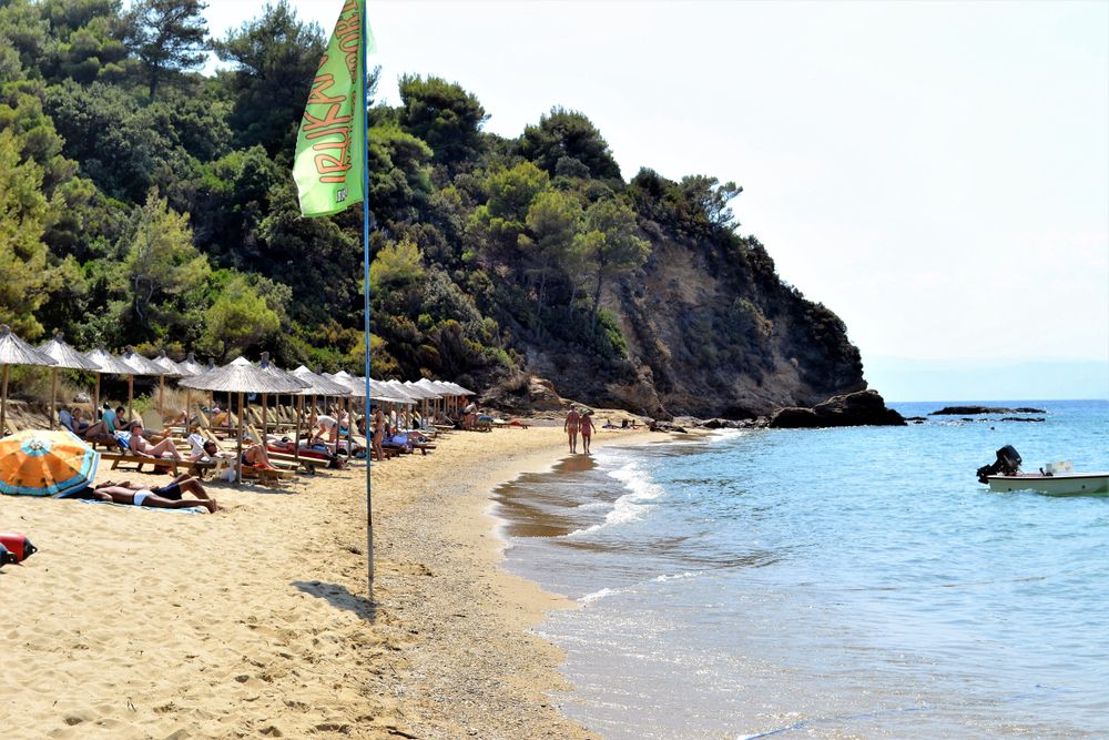 People enjoying the sun at Agia Eleni Beach
