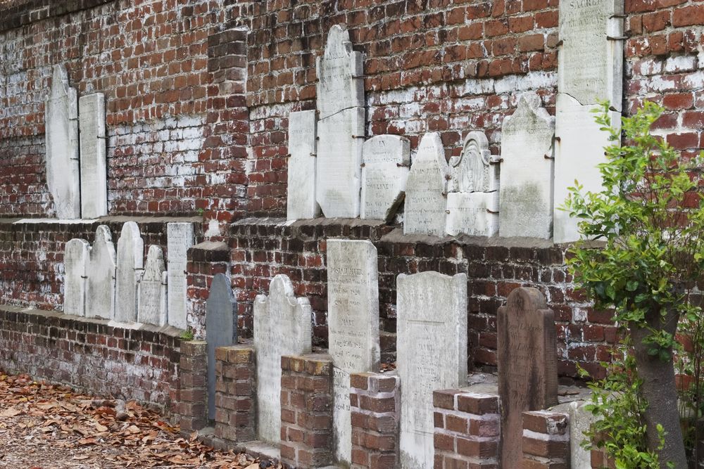 Headstones on a wall at Colonial Park Cemetery