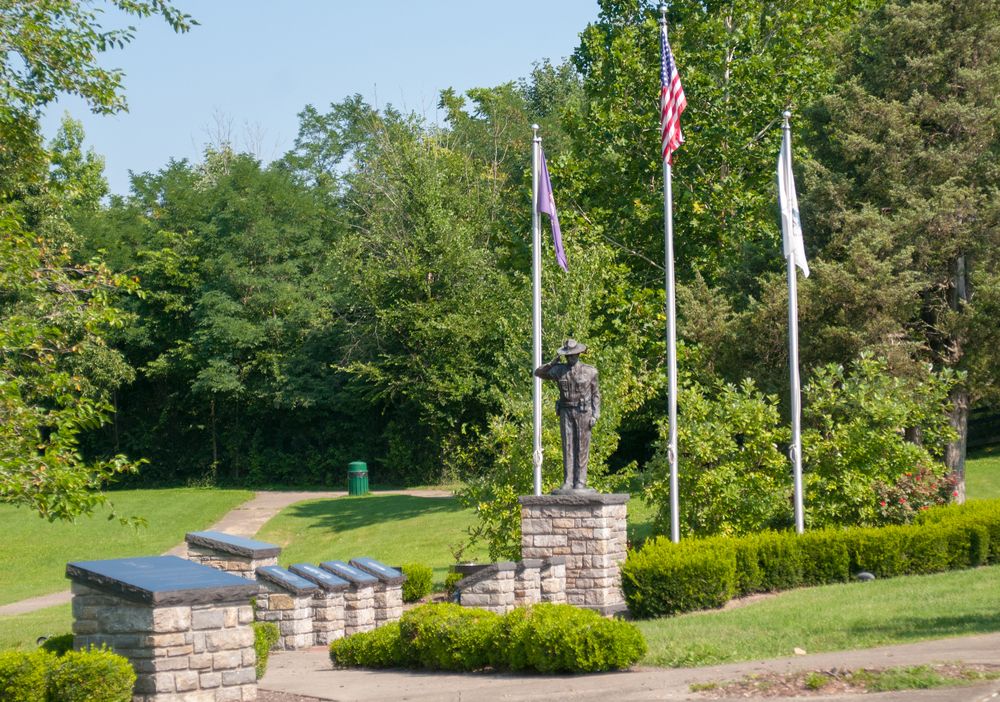 Flags and a bronze statue at Salato Wildlife Center.
