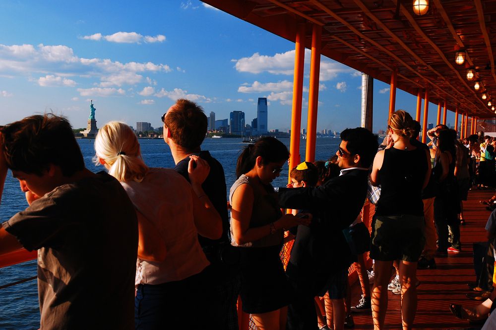 People enjoying the view from a Staten Island Ferry