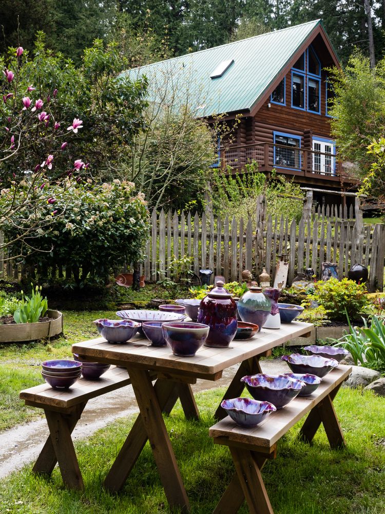 Outdoor table with pottery at Orcas Island Pottery