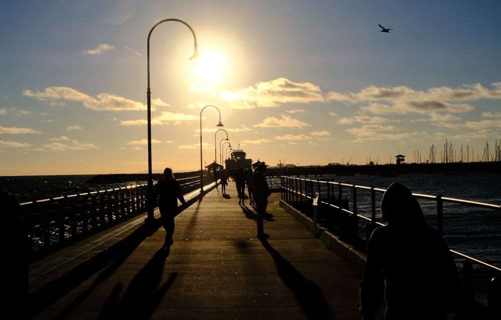 People walking along St Kilda Pier