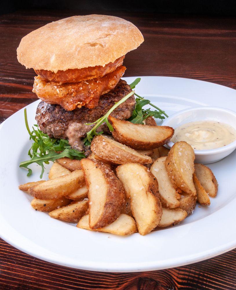 Plate of burger and fries in The Local Taphouse