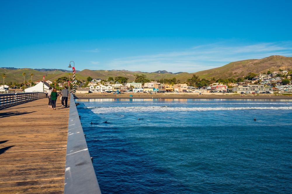 People walking along Cayucos Pier