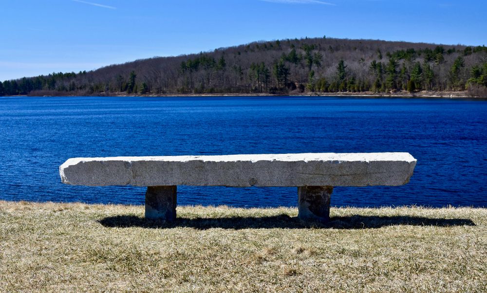 A stone bench overlooking Wachusett Reservoir