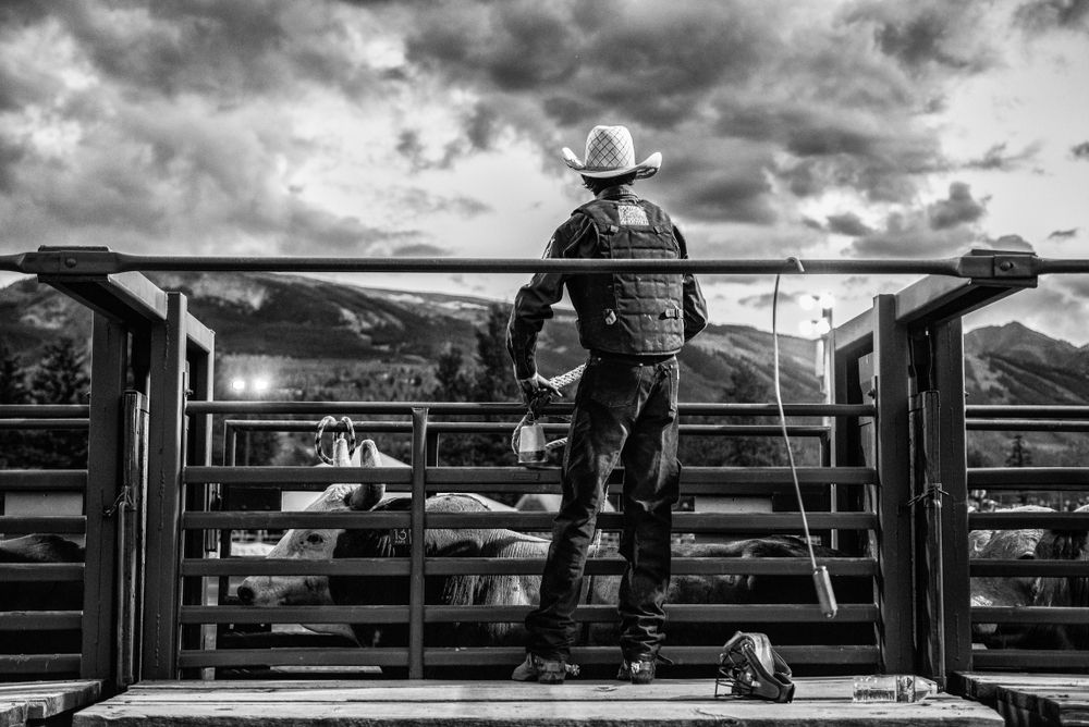 A man looking at the rodeo.